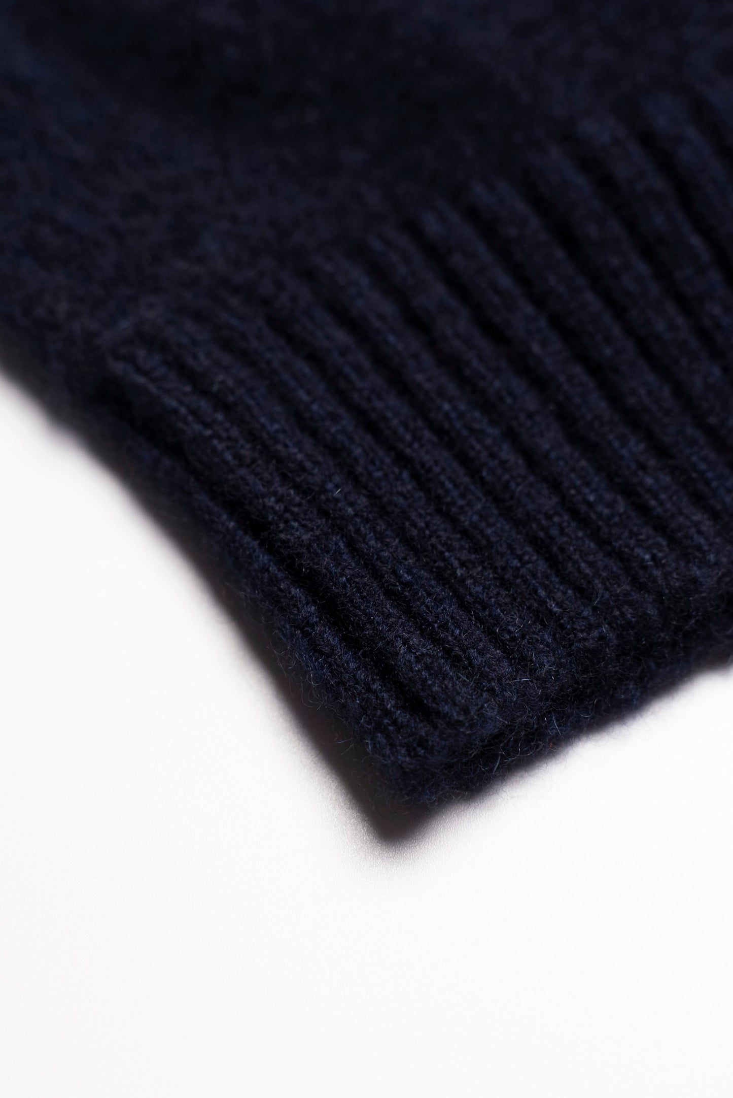Navy blue shaved cap with ribbed bottom